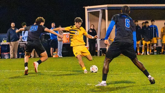 Isaac Scheer takes a shot for WVU men's soccer against Kentucky