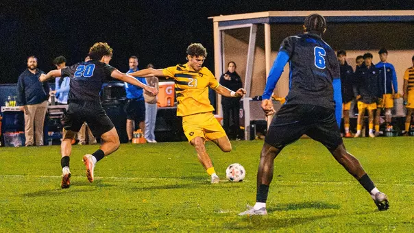 Isaac Scheer takes a shot for WVU men's soccer against Kentucky
