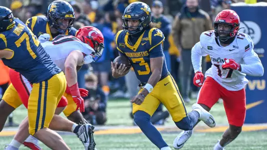 West Virginia quarterback Michael Hawkins Jr. scrambles for positive yardage in the Mountaineers' game against Cincinnati at Milan Puskar Stadium on Saturday, October, 17, 2026.