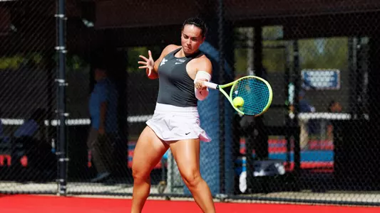 Laura Morillo returns a serve during the ITA Atlantic Regionals