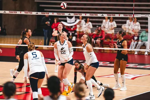 Anna Barr celebrates after winning a point against Texas Tech on Oct. 2