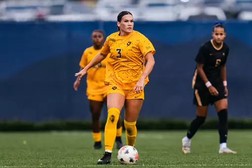 Jacey Rase dribbles a ball during a match at Dick Dlesk Soccer Stadium.