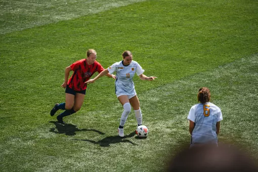Jordyn Wilson dribbles a ball past a defender at Dick Dlesk Soccer Stadium.