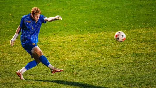 Toby Mawer kicks the ball for WVU Men's Soccer