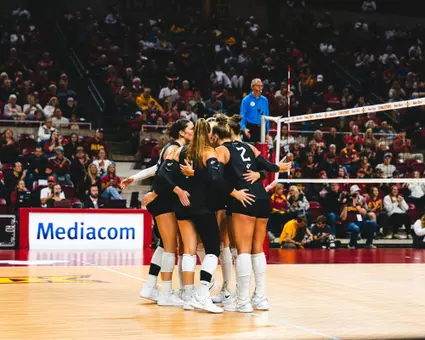 WVU Volleyball huddles before a point versus Iowa State
