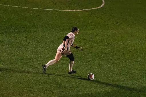 Bailey Herfurth dribbles a ball during a match at Dick Dlesk Soccer Stadium.
