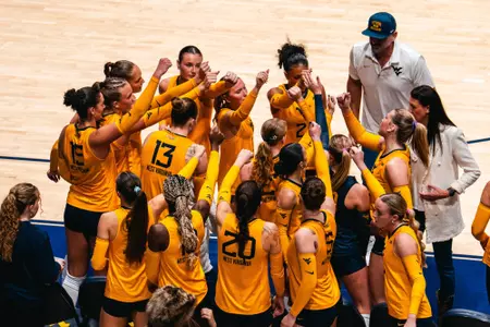WVU Volleyball team huddles before going back out to play Houston on Oct. 4