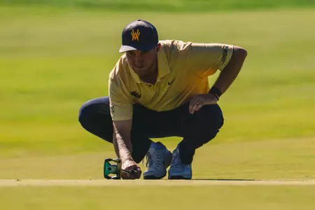 Jack Michael lines up a putt at Nemacollin