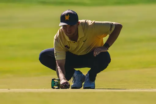 Jack Michael lines up a putt at Nemacollin
