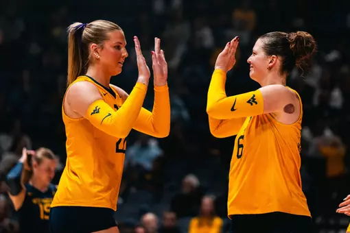 Maddy McGath and Saar Bertels high five during the Houston Match