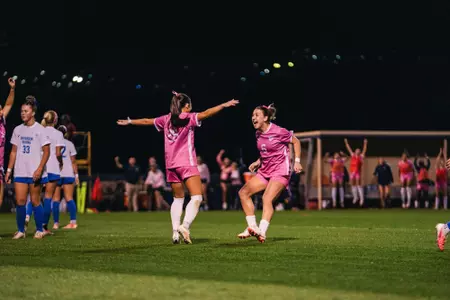 Sophia Nickel and Maya Leoni celebrate after a goal.