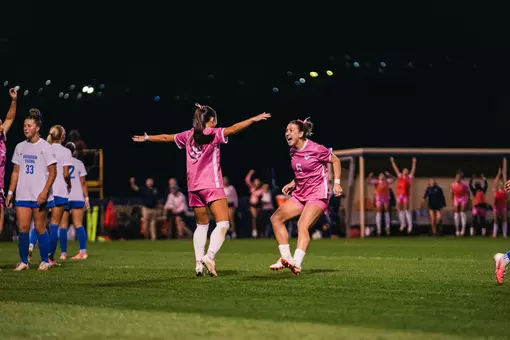 Sophia Nickel and Maya Leoni celebrate after a goal.