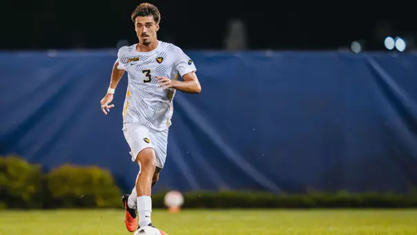 Aurelien Cormier dribbles the ball for WVU Men's Soccer