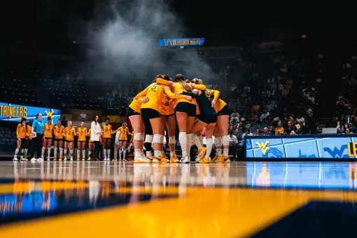 WVU huddles before the match against Houston on Oct. 4 inside Hope Coliseum