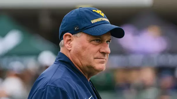 Head coach Rich Rodriguez looks on as the Mountaineers prepare for their game against Ohio in Athens, Ohio, on Sept. 6, 2025.