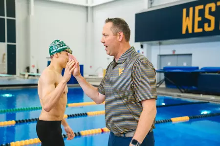 Brent MacDonald serves as the head swimming and diving coach at West Virginia University.