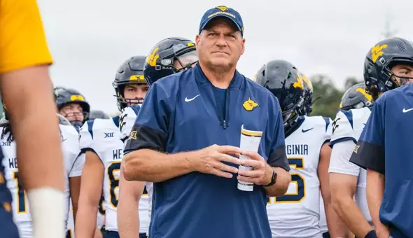 Head coach Rich Rodriguez prepares to take the field with the Mountaineers against Ohio in Athens, Ohio, on Sept. 6, 2025.