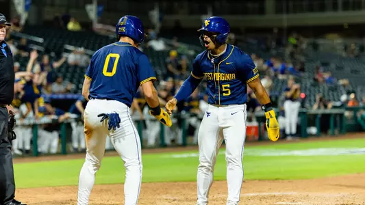 Armani Guzman celebrates with Matthew Graveline after taking the lead against Arizona State