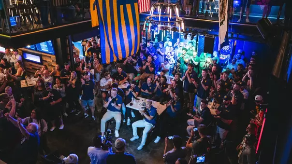 The West Virginia University baseball team watches its name come up on the board for the 2026 NCAA Tournament during its team watch party at The Goat Country Roads Pub in Morgantown, West Virginia, on Monday, May 25, 2026.