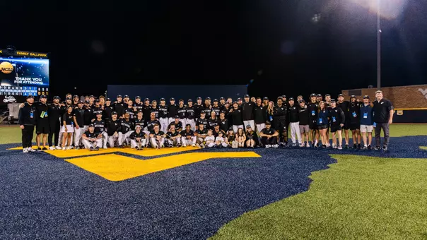 The West Virginia baseball team poses for a photo after winning the Morgantown Regional