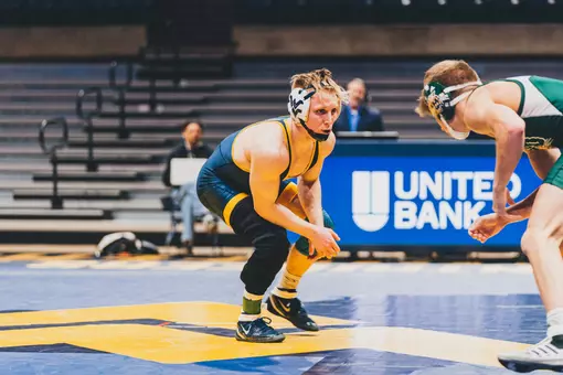 Killian Cardinale competes against a wrestler from Ohio University in a match at Hope Coliseum for WVU wrestling.
