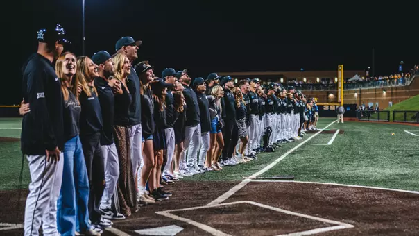 West Virginia University baseball players, coaches and staffers sing Take Me Home, Country Roads following the Mountaineers' come-from-behind, 10th inning victory over Kentucky at Kendrick Family Ballpark on Monday, June 1, 2026.