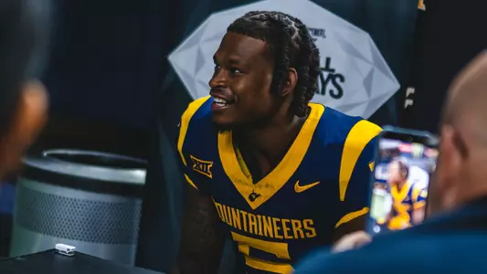 West Virginia University football player Jaden Bray talks to media during Wednesday's Big 12 media day at The Ford Center in Frisco, Texas.