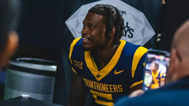 West Virginia University football player Jaden Bray talks to media during Wednesday's Big 12 media day at The Ford Center in Frisco, Texas.