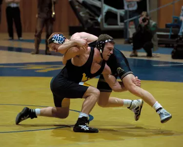 Mike Mason wrestled for the Mountaineers in the 1990s, becoming a two-time All-American.