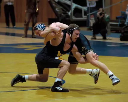 Mike Mason wrestled for the Mountaineers in the 1990s, becoming a two-time All-American.