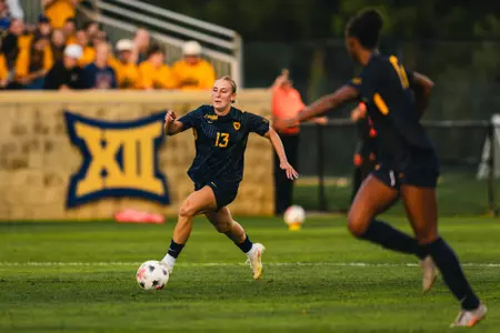 Anna Hauer of the WVU women's soccer team dribbles down the field during a match on Aug. 20.
