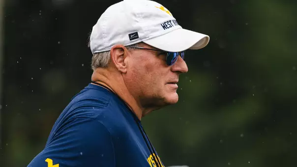 West Virginia coach Rich Rodriguez observes a preseason practice up on the Steve Antoline Family Practice Field in August, 2026.