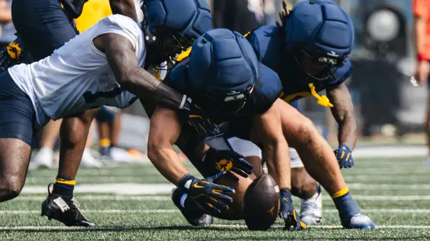 Unidentified West Virginia defenders recover a fumble during the first practice of fall training camp on Wednesday, August, 5, 2026.