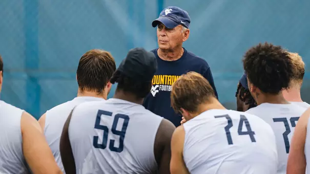 West Virginia offensive line coach Rick Trickett talks to his players during a practice inside Milan Puskar Stadium in the spring of 2026.