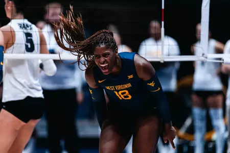 Trinity Sheridan celebrates after knocking off VCU in the West Virginia Invitational