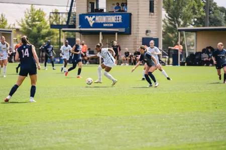 Layla Thompson dribbles the ball during a game at Dick Dlesk Soccer Stadium.