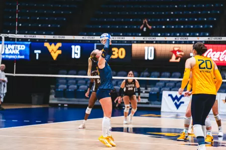 Reagan Turk sets the ball against Lehigh