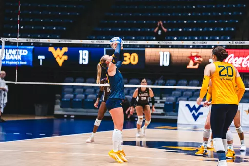 Reagan Turk sets the ball against Lehigh