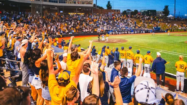 Fans at Kendrick Family Ballpark celebrate during the NCAA Morgantown Regional