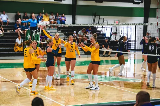 Anna Barr finishes a kill while playing against Tarleton State in the UNT Invitational