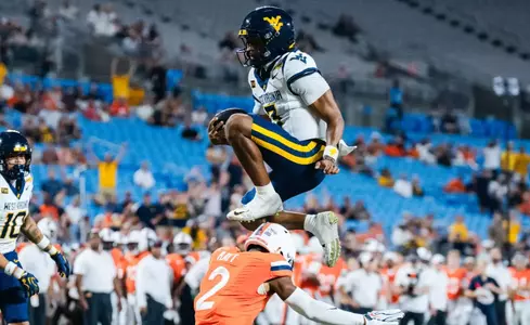 Quarterback Michael Hawkins Jr. (3) scores a rushing touchdown in the first quarter against No. 25 Virginia at Bank of America Stadium on Sept. 19, 2026, in Charlotte, N.C.