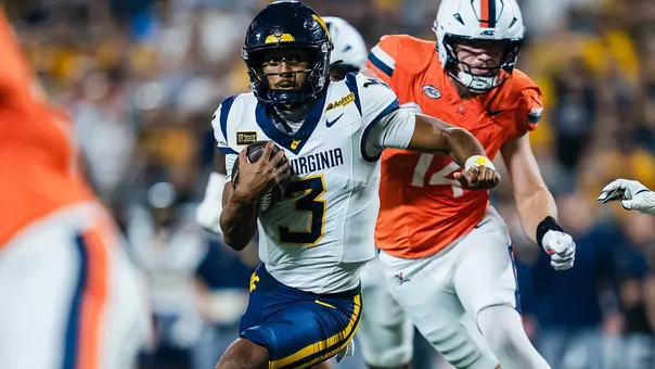Michael Hawkins runs for a 13-yard touchdown in the first quarter of West Virginia's Duke's Mayo Classic at Bank America Stadium in Charlotte, North Carolina.