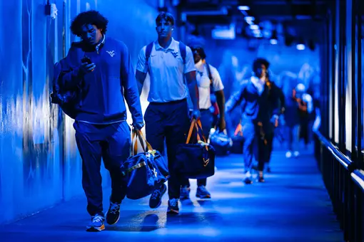 West Virginia players arrive at Bank of America Stadium before their game against No. 25 Virginia on Sept. 19, 2026, in Charlotte, N.C.