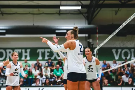 Anna Barr celebrates following a point during the North Texas Invitational