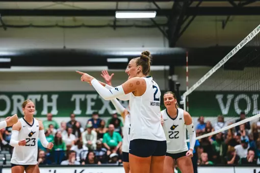 Anna Barr celebrates following a point during the North Texas Invitational