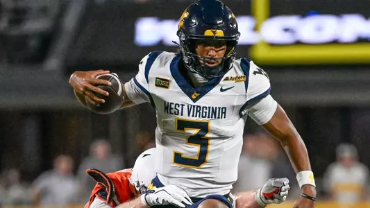 Quarterback Michael Hawkins Jr. scores a 13-yard touchdown in the first quarter of West Virginia's 38-27 victory over 25th-ranked Virginia on Saturday, Sept. 19, 2026 at Bank of America Stadium in Charlotte, North Carolina.