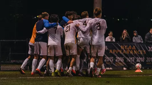 West Virginia celebrates after Sammie Walker scores a goal against Duquesne
