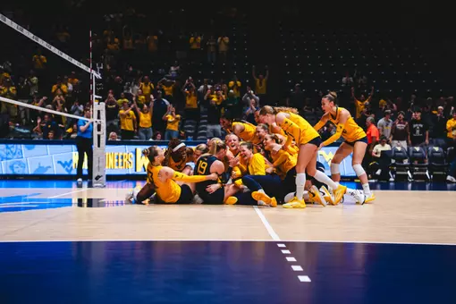 WVU Volleyball Celebrates after defeating No. 9 Arizona State