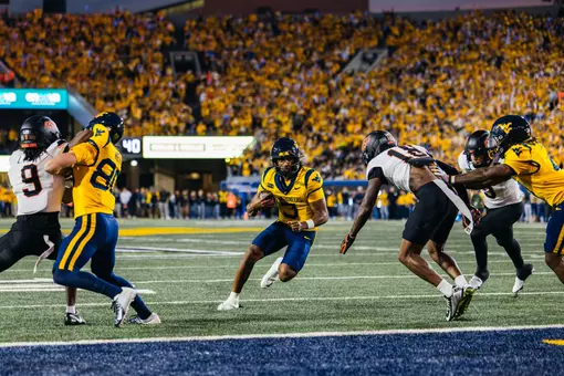 Michael Hawkins Jr. (3) rushes for a touchdown in the first quarter against Oklahoma State on Sept. 26, 2026, in Morgantown, W.Va.