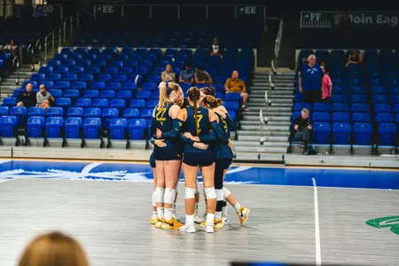 WVU huddles as they take on FAU in the Sunshine State Classic